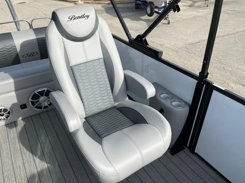 Slide: The Image of 2025 Bentley Pontoons Elite 223 Swingback luxury seating with cup holders and stylish design. - 14