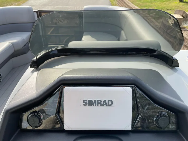 Slide: The Image of 2025 Bentley Pontoons Elite 223 Swingback dashboard with Simrad navigation system. - 20