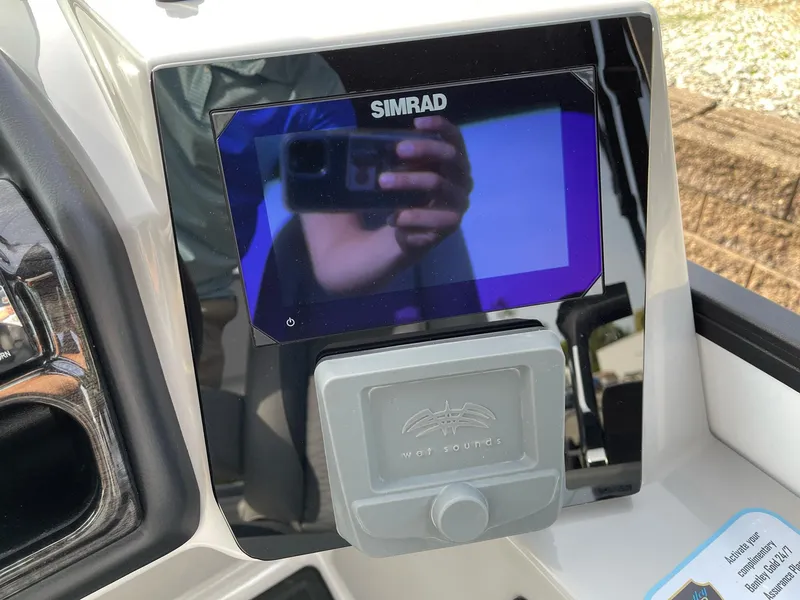Slide: The Image of Simrad display on 2025 Bentley Pontoons Elite 223 Swingback dashboard. - 21