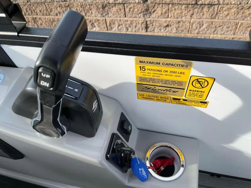 Slide: The Image of Bentley Pontoons Elite 223 Swingback 2025 control panel with capacity warning label. - 22