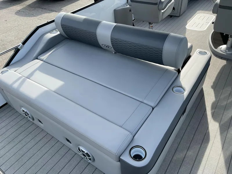 Slide: The Image of 2025 Bentley Pontoons Elite 223 Swingback with luxurious seating and cup holders. - 24