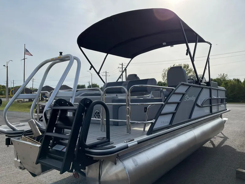 Slide: The Image of 2025 Bentley Pontoons Elite 223 Swingback with canopy, sleek design, and modern features. - 6