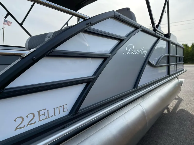 Slide: The Image of 2025 Bentley Pontoons Elite 223 Swingback, sleek design with elegant branding details. - 7