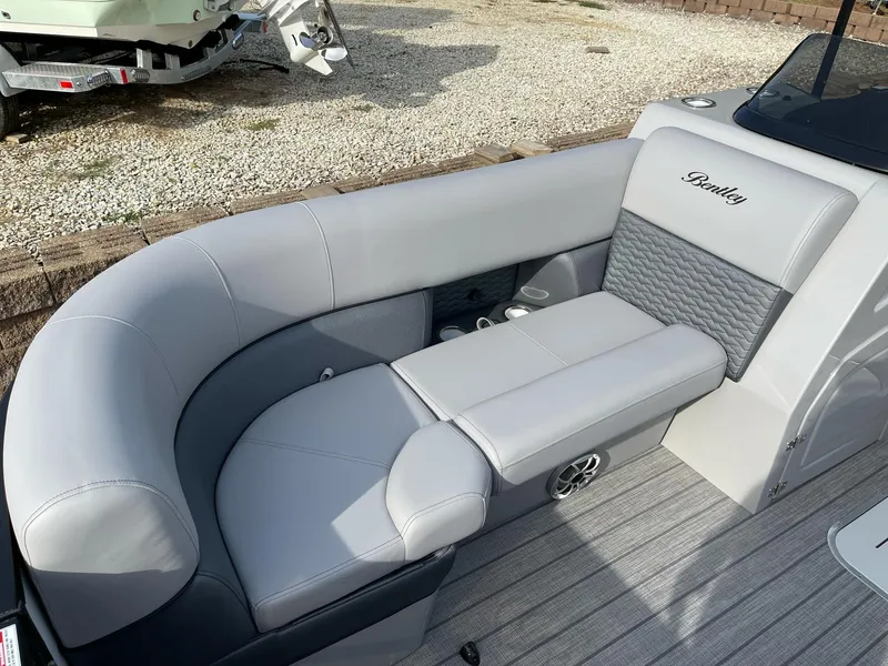 Slide: The Image of 2025 Bentley Pontoons Elite 223 Swingback with luxurious gray seating and modern design. - 9