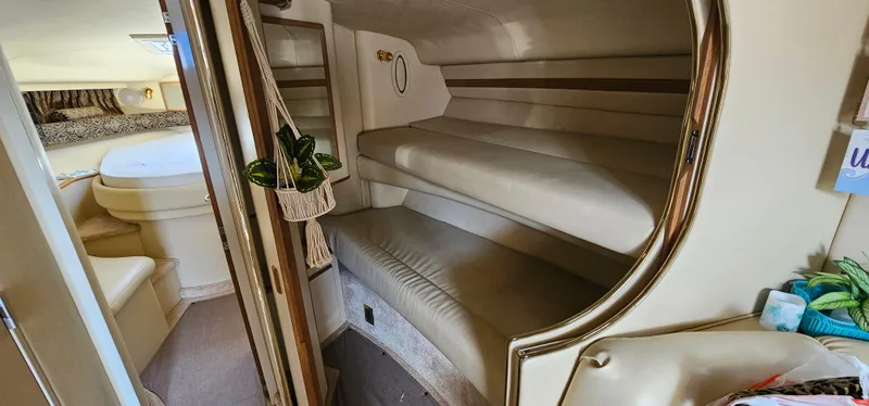 Slide: The Image of 1999 Sea Ray 400 Express Cruiser interior with cozy bunk beds and elegant design. - 41