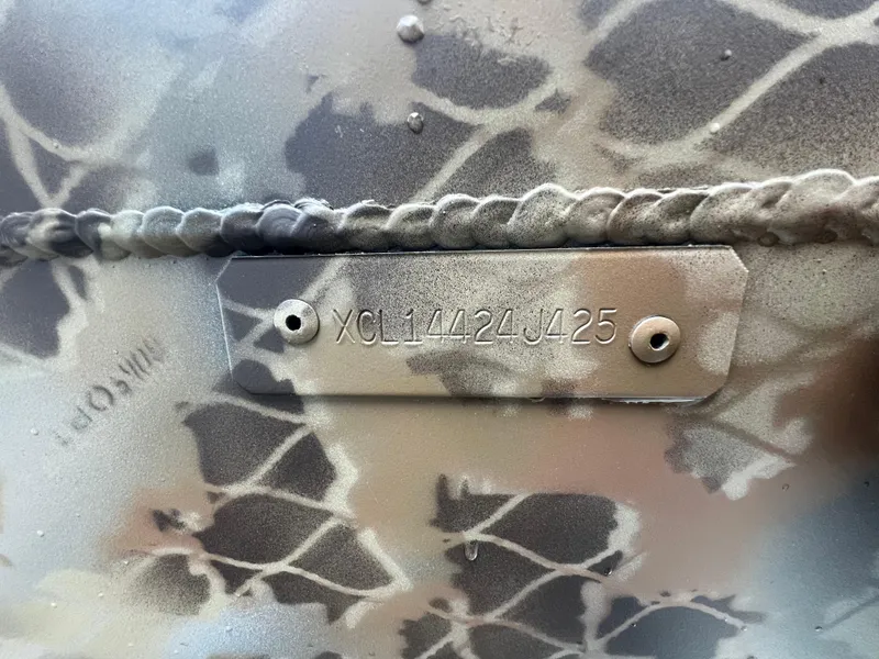 Slide: The Image of VIN plate on camouflaged 2025 Excel 2072 Stalker SC boat. - 13