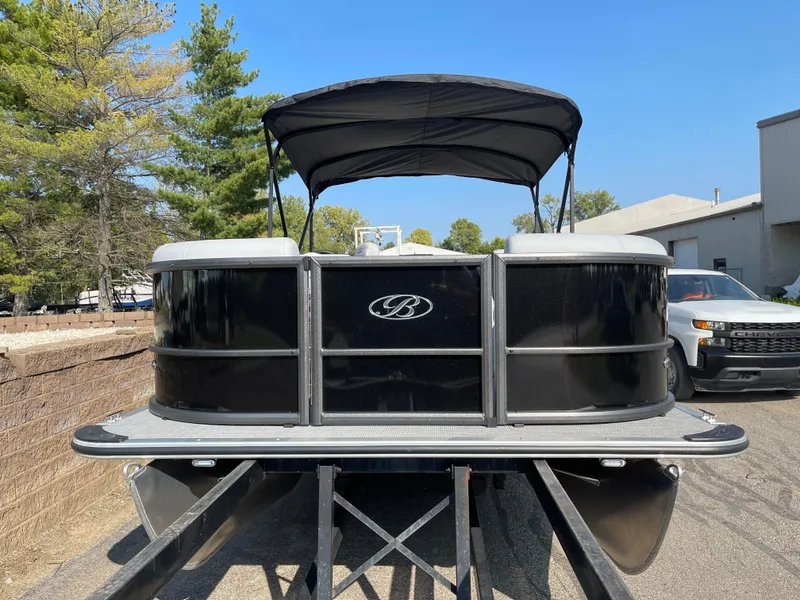 Slide: The Image of 2024 Bentley Pontoons LE 20 CW pontoon boat with canopy on trailer. - 1