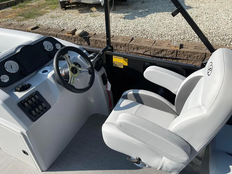Slide: The Image of 2024 Bentley Pontoons LE 20 CW helm with steering wheel and captain's chair. - 11