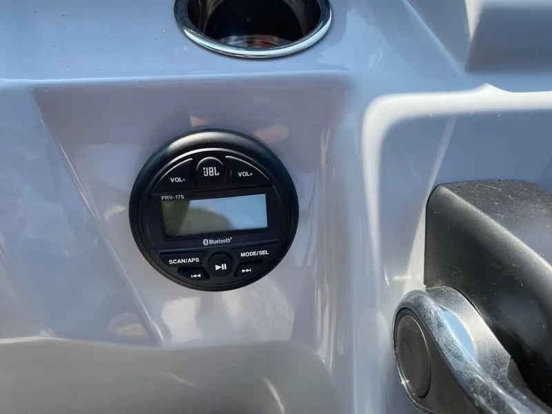 Slide: The Image of 2024 Bentley Pontoons LE 20 CW dashboard with JBL audio system. - 14