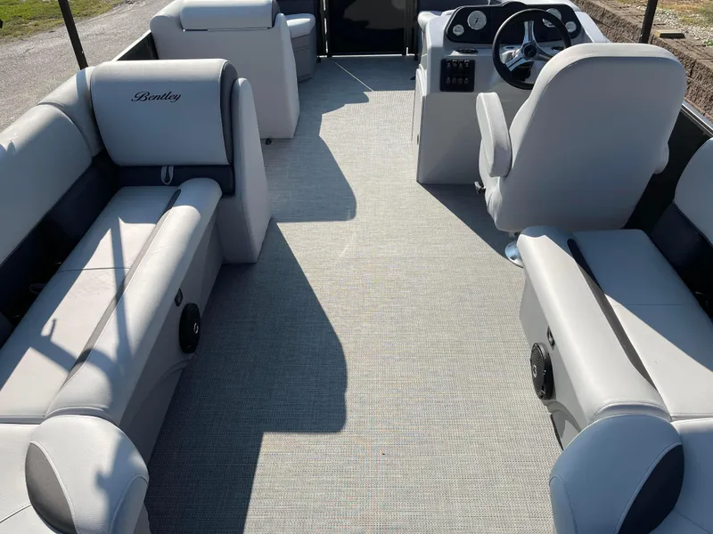 Slide: The Image of 2024 Bentley Pontoons LE 20 CW interior with plush seating and modern dashboard. - 18