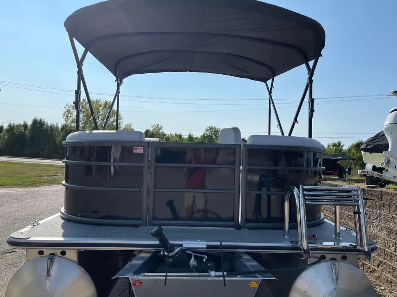 Slide: The Image of 2024 Bentley Pontoons LE 20 CW with canopy, parked outdoors. - 4