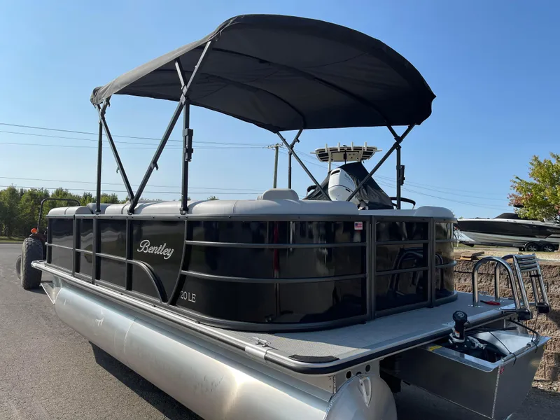 Slide: The Image of 2024 Bentley Pontoons LE 20 CW with canopy, parked on a sunny day. - 5