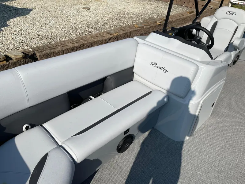 Slide: The Image of 2024 Bentley Pontoons LE 20 CW interior with white and gray seating. - 8