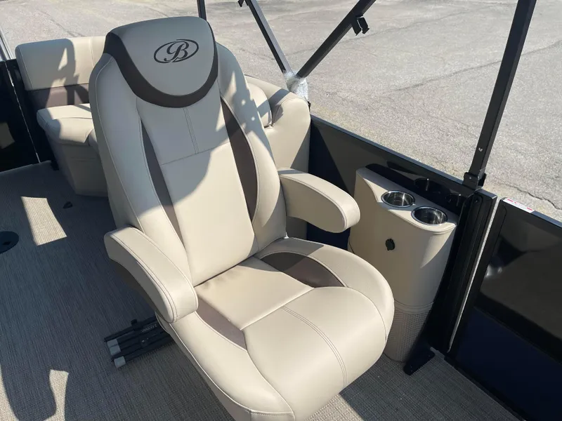 Slide: The Image of 2024 Bentley Pontoons Legacy 200 Navigator captain's chair with cup holders. - 13