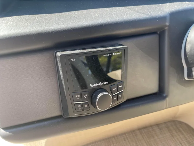 Slide: The Image of 2024 Bentley Pontoons Legacy 200 Navigator dashboard with Rockford Fosgate audio system. - 17