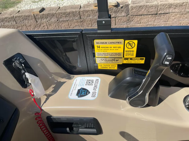 Slide: The Image of 2024 Bentley Pontoons Legacy 200 Navigator control panel with capacity warning labels. - 21