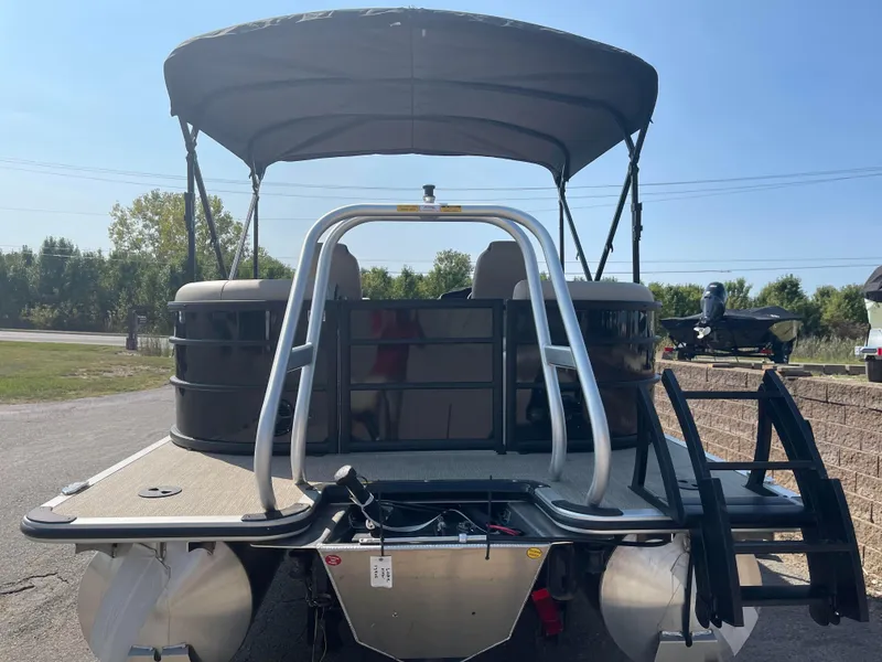 Slide: The Image of 2024 Bentley Pontoons Legacy 200 Navigator with canopy, rear view. - 3