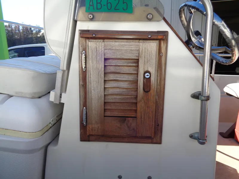 Slide: The Image of Wooden hatch on 1980 Boston Whaler 17 Montauk boat interior. - 16