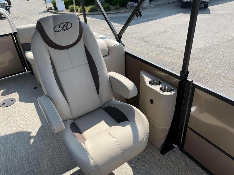 Slide: The Image of 2024 Bentley Pontoons Legacy 200 Navigator captain's chair with cup holders. - 12