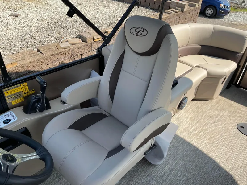 Slide: The Image of 2024 Bentley Pontoons Legacy 200 Navigator interior with plush seating and modern design. - 13