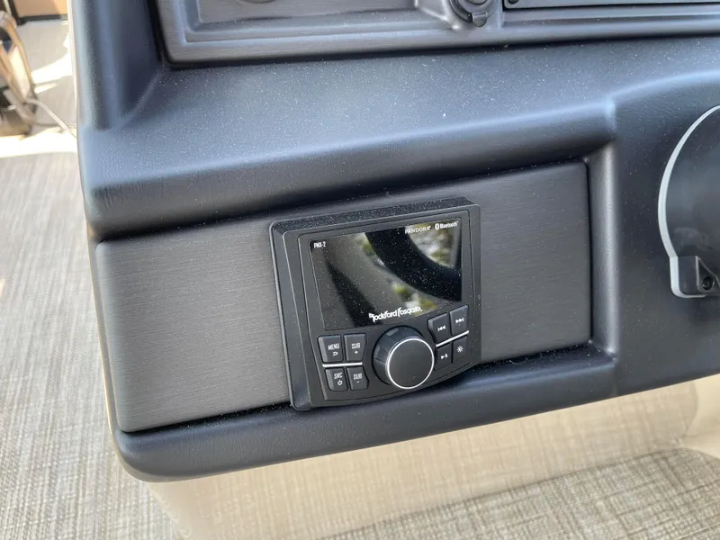 Slide: The Image of 2024 Bentley Pontoons Legacy 200 Navigator dashboard with Rockford Fosgate audio system. - 15