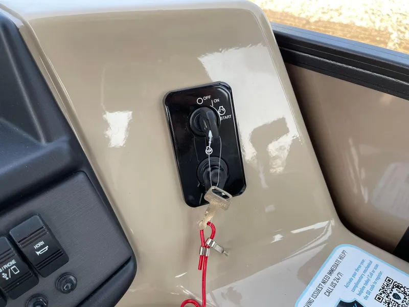 Slide: The Image of 2024 Bentley Pontoons Legacy 200 Navigator ignition panel with keys inserted. - 19