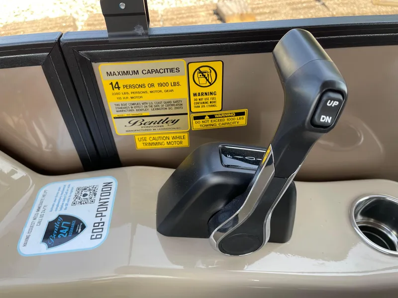 Slide: The Image of 2024 Bentley Pontoons Legacy 200 Navigator throttle control with capacity warning labels. - 20