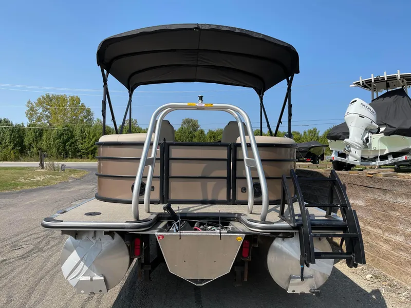 Slide: The Image of 2024 Bentley Pontoons Legacy 200 Navigator, rear view with canopy and ladder. - 3