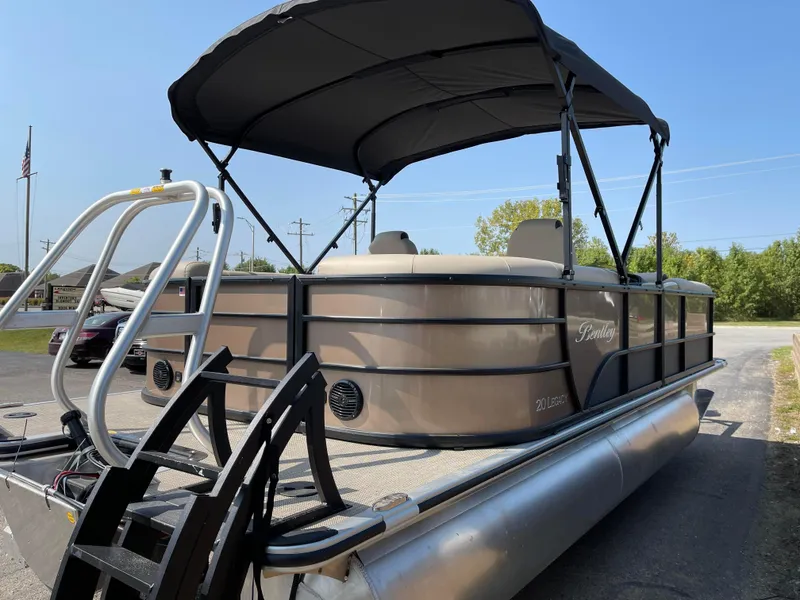 Slide: The Image of 2024 Bentley Pontoons Legacy 200 Navigator with canopy, docked on a sunny day. - 4