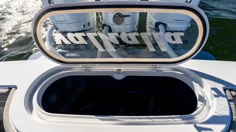 Slide: The Image of 2025 Valhalla Boatworks V-37 livewell with open lid, showcasing powerful outboard engines. - 13