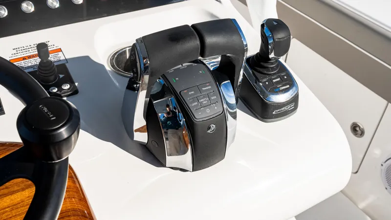 Slide: The Image of Control panel of 2025 Valhalla Boatworks V-37 with throttle and joystick. - 26