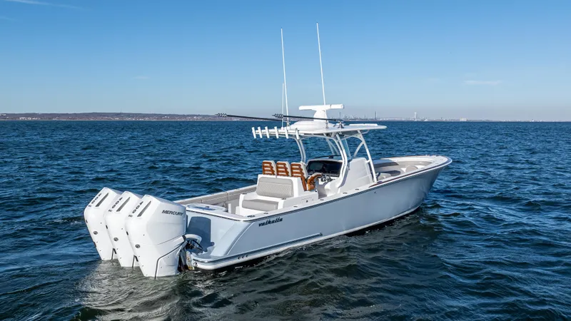 Slide: The Image of 2025 Valhalla Boatworks V-37 cruising on open water with triple outboard engines. - 3