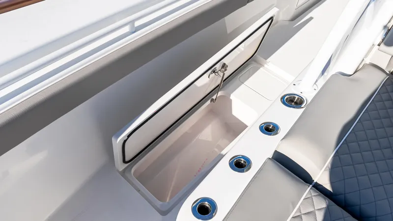 Slide: The Image of 2025 Valhalla Boatworks V-37 interior with open storage compartment and seating. - 35