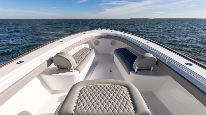 Slide: The Image of 2025 Valhalla Boatworks V-37 on open water, featuring luxurious seating and sleek design. - 37