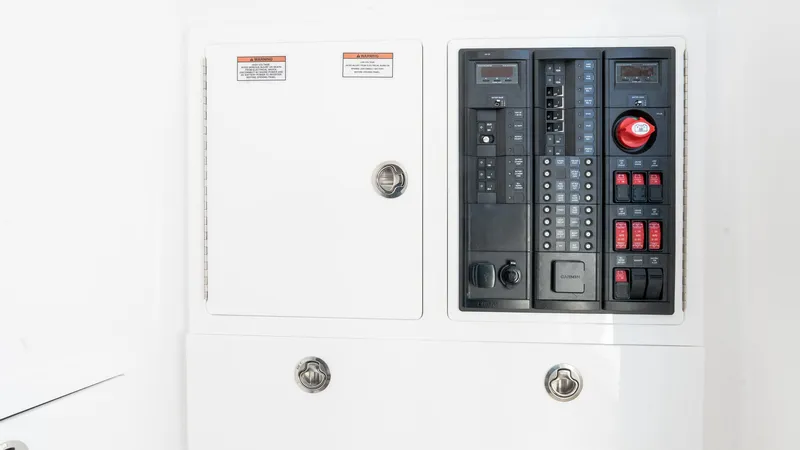 Slide: The Image of Electrical panel of 2025 Valhalla Boatworks V-37, featuring control switches and circuit breakers. - 48