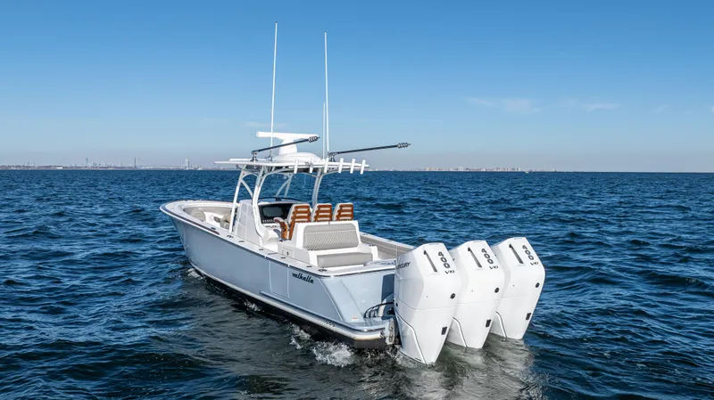 Slide: The Image of 2025 Valhalla Boatworks V-37 cruising on open water with triple outboard engines. - 5