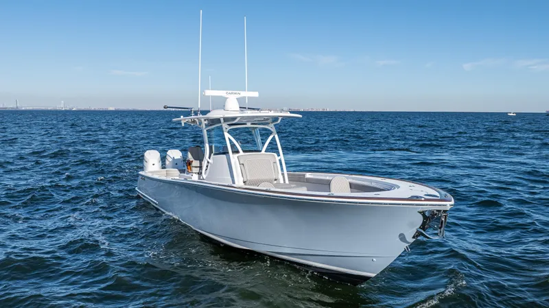 Slide: The Image of 2025 Valhalla Boatworks V-37 cruising on open water under clear skies. - 2