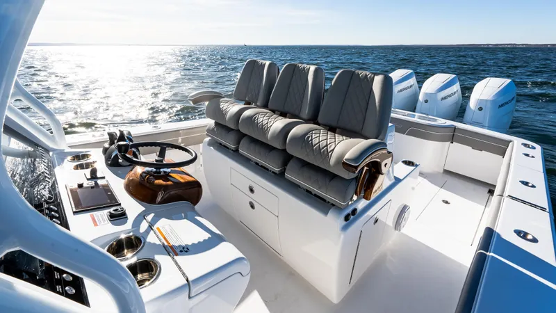 Slide: The Image of 2025 Valhalla Boatworks V-37 with luxurious seating and modern controls on open water. - 22