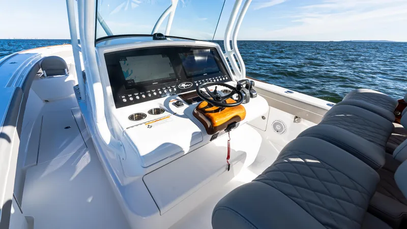 Slide: The Image of 2025 Valhalla Boatworks V-37 helm with modern controls on open water. - 29