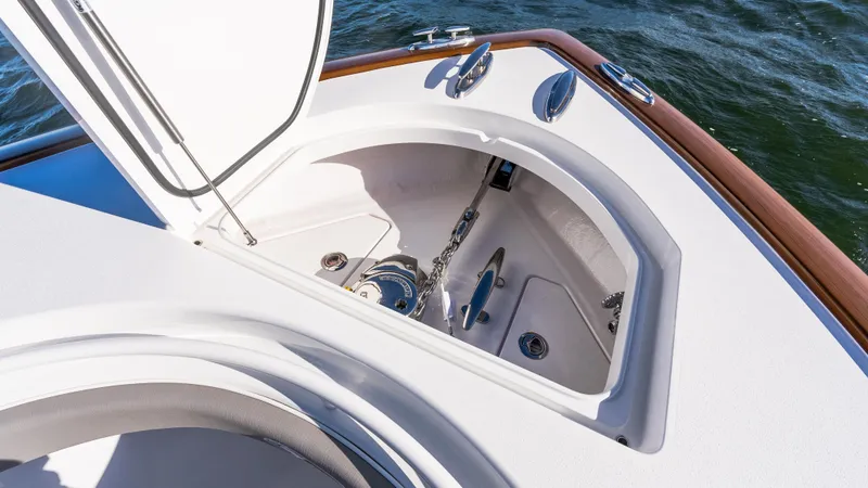 Slide: The Image of 2025 Valhalla Boatworks V-37 anchor compartment with open hatch, showcasing marine hardware. - 38