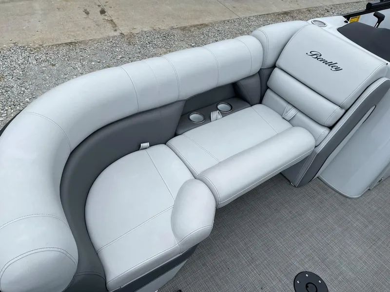 Slide: The Image of 2022 Bentley Pontoons Elite 223 Swingback with luxurious white seating and cup holders. - 10