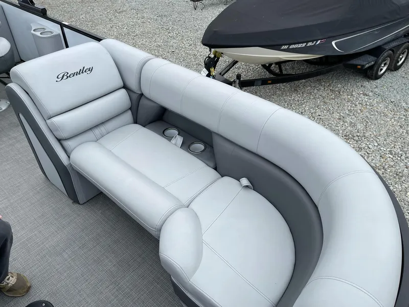 Slide: The Image of 2022 Bentley Pontoons Elite 223 Swingback with luxurious seating and cup holders. - 11