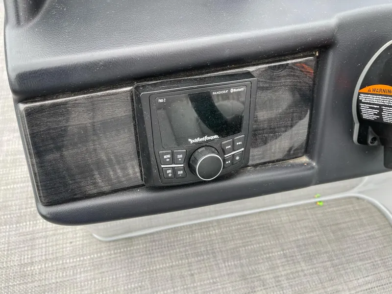 Slide: The Image of 2022 Bentley Pontoons Elite 223 Swingback dashboard with Rockford Fosgate audio system. - 16