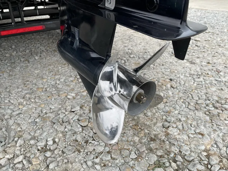 Slide: The Image of Close-up of a 2022 Bentley Pontoons Elite 223 Swingback propeller on gravel. - 4