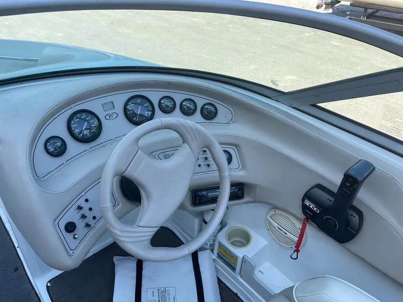 Slide: The Image of 1996 Cobalt 190 Bowrider dashboard with steering wheel and control panel. - 11