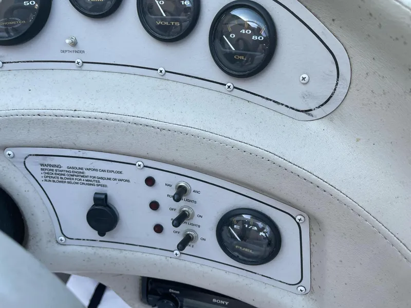 Slide: The Image of Dashboard of a 1996 Cobalt 190 Bowrider boat with gauges and controls. - 14