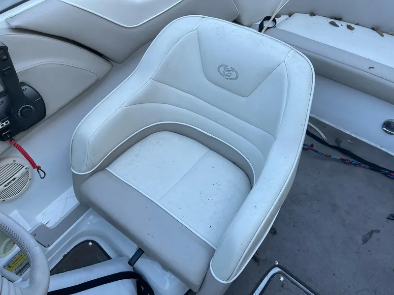 Slide: The Image of White leather seat in 1996 Cobalt 190 Bowrider boat interior. - 15