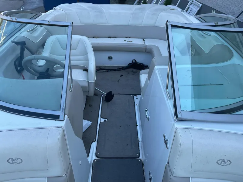 Slide: The Image of 1996 Cobalt 190 Bowrider boat interior with white seating and dual windshields. - 17