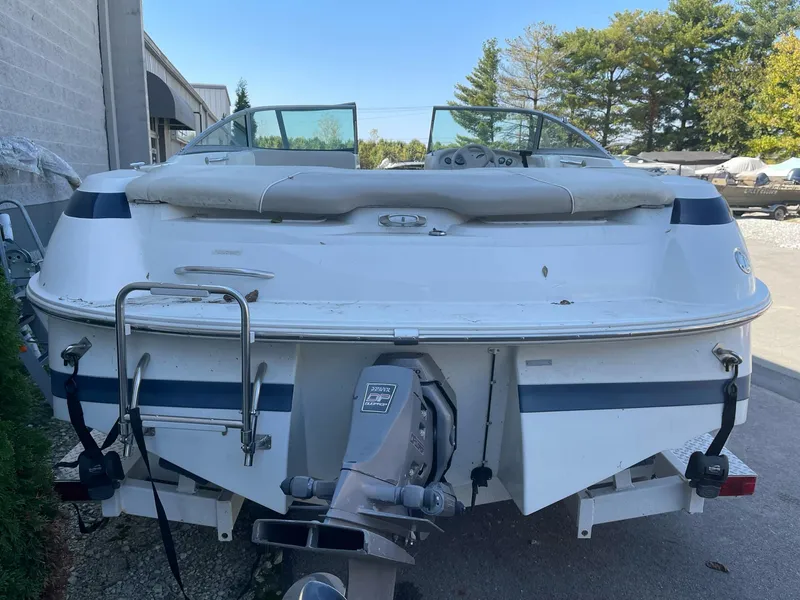 Slide: The Image of 1996 Cobalt 190 Bowrider boat, rear view with outboard motor and ladder. - 2