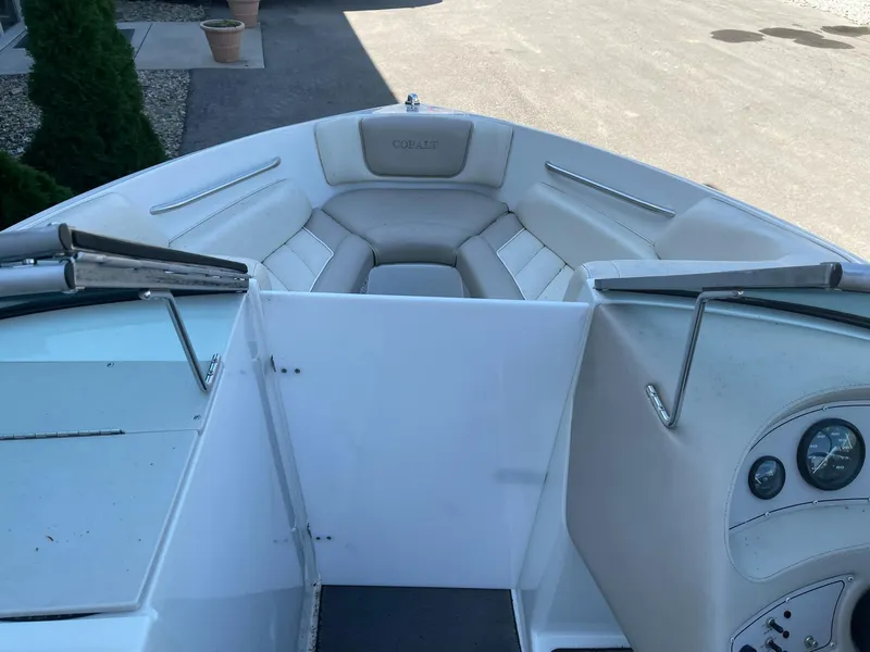 Slide: The Image of 1996 Cobalt 190 Bowrider boat interior with seating and dashboard view. - 9